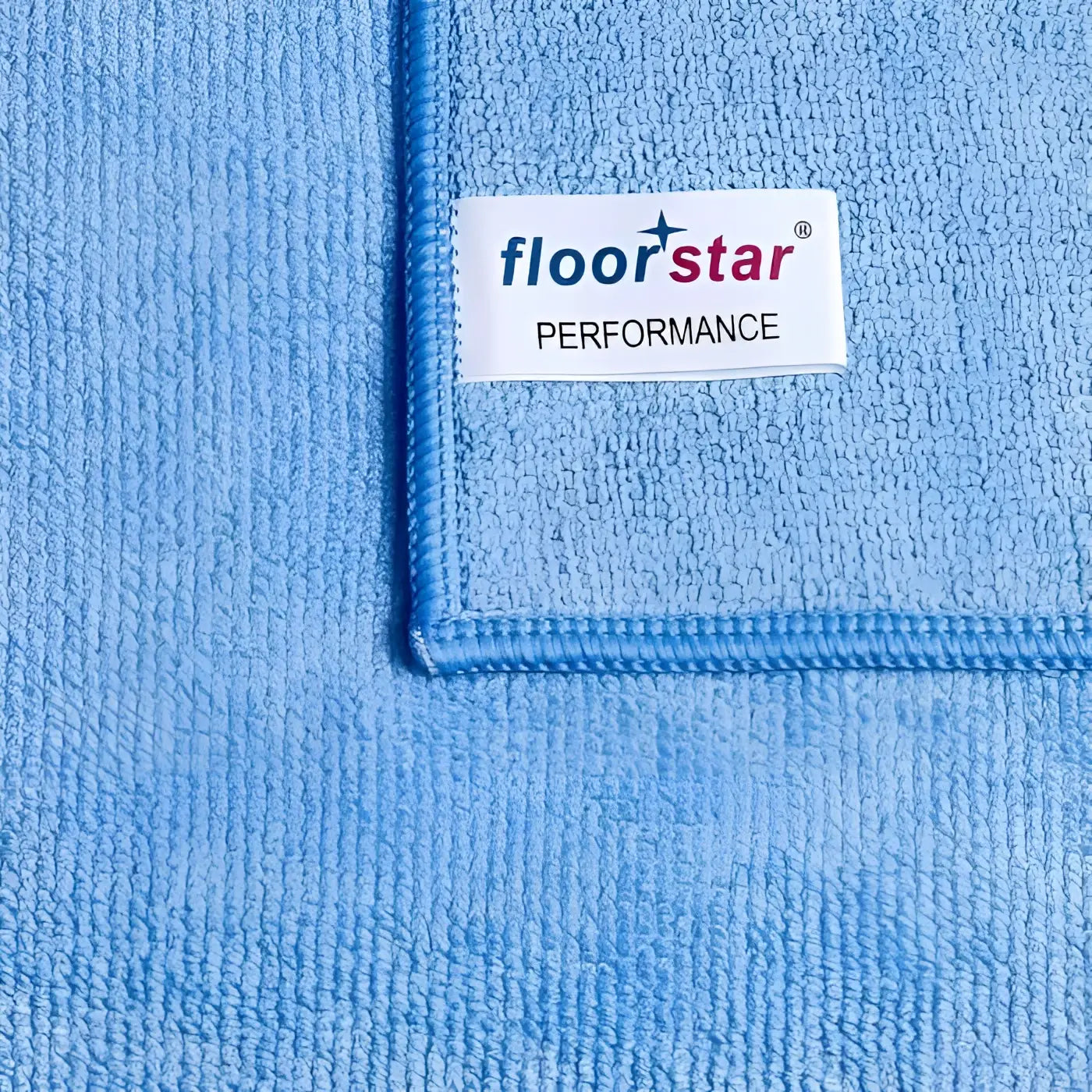 Hellblaues mikrofaser-bodentuch floorstar performance 50x70 cm mit weißem label und hochwertiger reinigungsfunktion