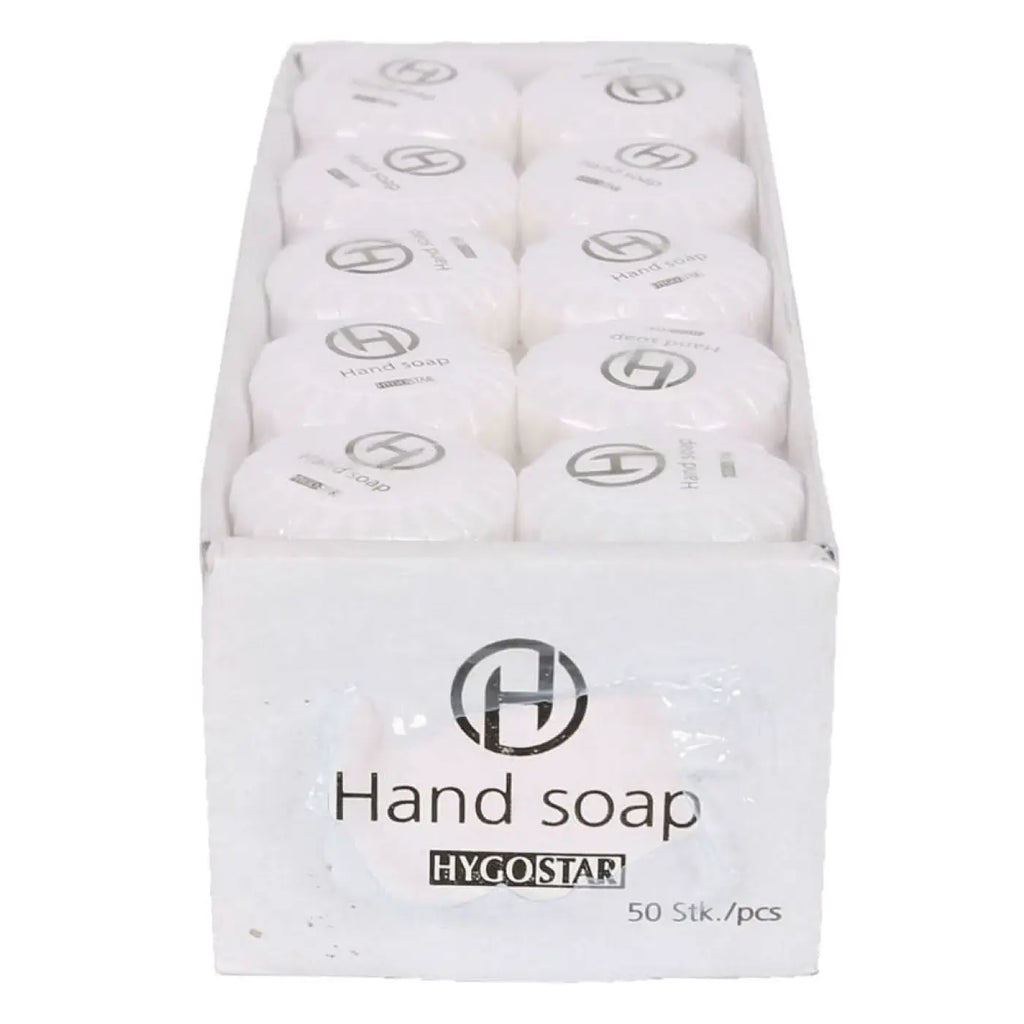 Weiße runde handseifenstücke mit hygostar logo in einer box hygienisch und hautschonend 50 stück