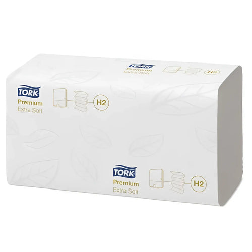 Weißer tork premium extra weicher tork xpress h2 multifold handtuchpapier spender mit goldfarbenem branding und blattmustern