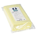 A pale yellow rectangular Wetrok Masslinn cleaning sponge wrapped in clear plastic packaging for dust binding